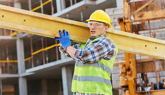 Construction worker reviewing site details